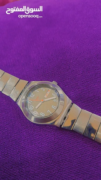 > ساعة Swatch Irony أصلية للبيع  ستانلس ستيل كاملة عرض يوم وتاريخ مقاومة للماء   ( تحتاج فقط بطارية)
