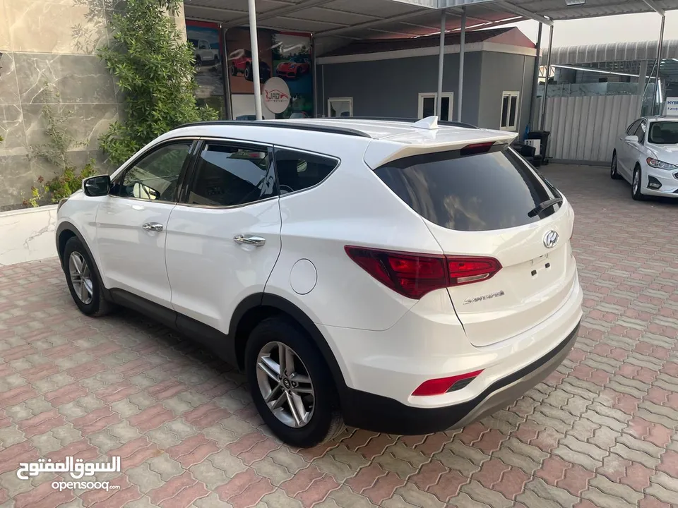 Hyundai Santa Fe Sport 4X4 سانتافي سبورت دفع رباعي  وارد أمريكي أوراق جمارك بصمة مقاعد كهربائية