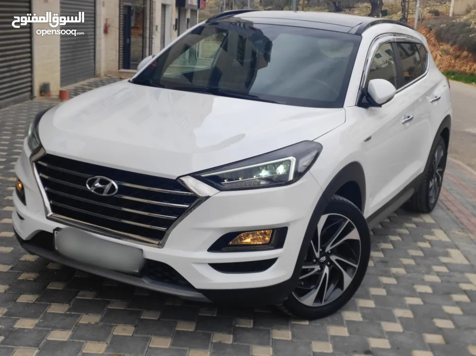 هونداي توسان فل الفل اضافات دهان شركة وعداد أصلي 70000كم فقططط رخصة وتأمين شامل للبيع بسعر مغري