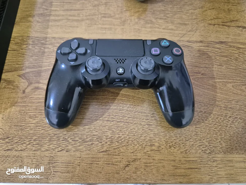 PS4 Slim 1 TB with 2 dualshock 4 controllers and 4 games