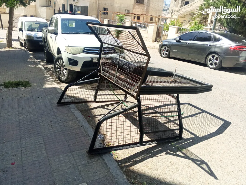 رول بار مع سلة وشبك (غرفة شبك) لبك اب ميتسوبيشي من موديل 2000 ولغاية 2006 بحالة الوكاله