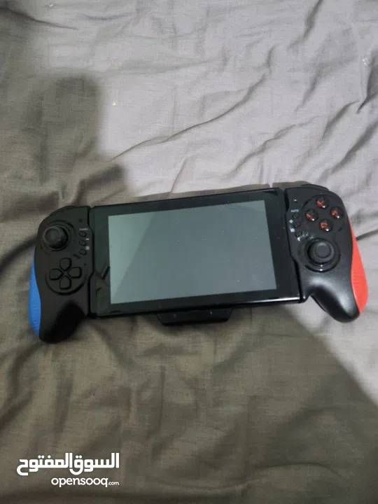 نينتندو سويتش مع كينترولارنينتندو سويتش مع كينترولارنينتندو سويتش مع كينترولار