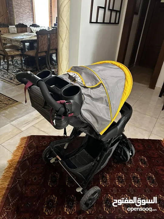 عرباية اطفال مع مقعد سيارة نوع GRACO