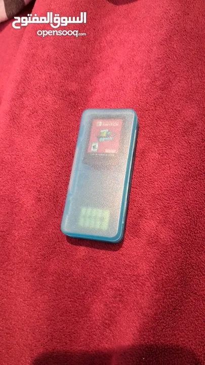 نينتيندو سويتش اوليد مع العاب و العاب بلايستيشن 4 و 5