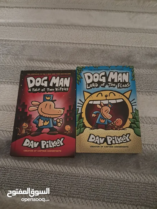 a pair of 'Dog Man' books , one called "Dog Man a tale of 2 kitties" and another one "lord of fleas"