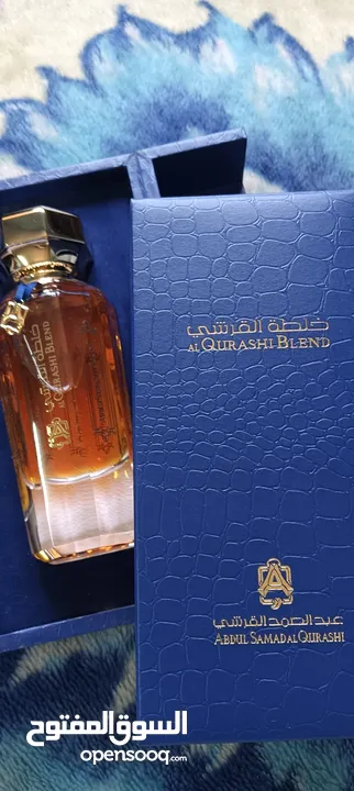 عطر خلطه القرشي جديد90مل للرجال والنساء  مع ستاند خشب لون ازرق