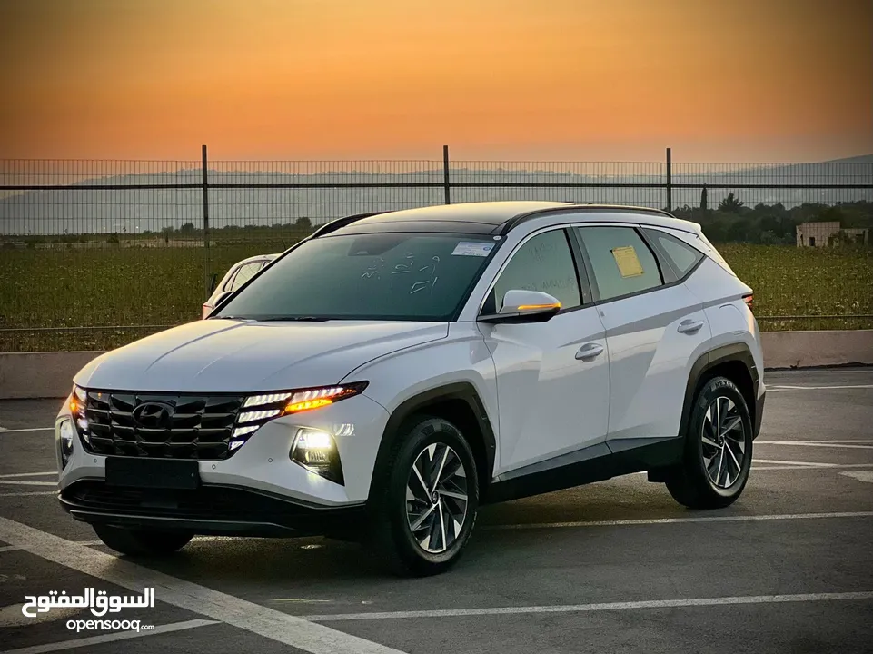هونداي توسان 2023/ فل الفل فتحة سقف بانوراما  2x4 ///240Hp بنزين + كهرباء  ( Haybrid) 1600cc