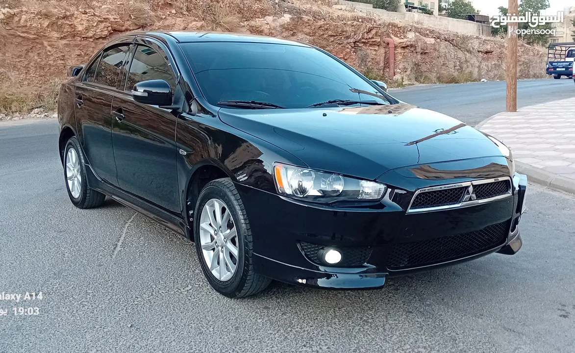 متسوبيشي لانسر فراشة موديل 2015 فحص مرفق مع الصور بحالة الوكاااااالة  ماشية 49 الف km  أصلي