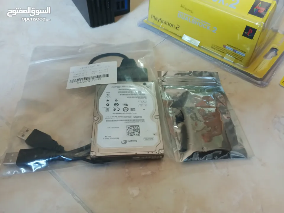 بلايستيشن 2 معدلة مع اسلاك + ميموري جديدة هدية + هارديسك وميموري عليهم 60 لعبة مميزة