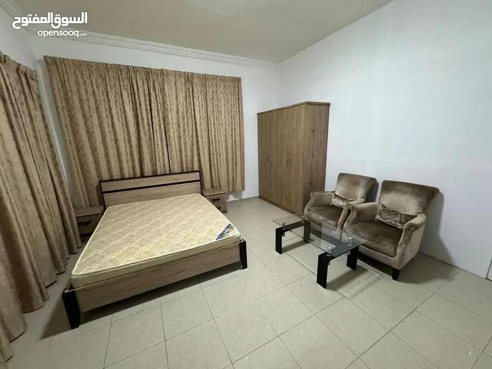 Private room with balcony in clean Apartment in Al Taawun