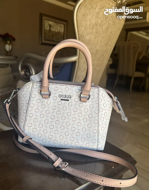 Original brand new GUESS cross body bag with original tag. Shipped all the way from America to Amman