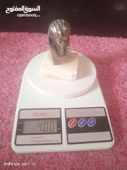 مجسم نحاس احمر وقاعده حجر