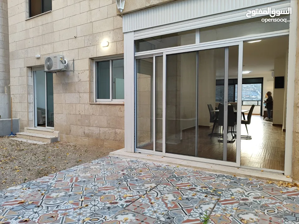 شقة جديدة مفروشة مع حديقة للإيجار – عين منجد  شارع إسكان المهندسين