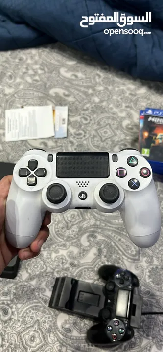 Ps4 with two controllers and 4 games including overwatxh ultimate edition