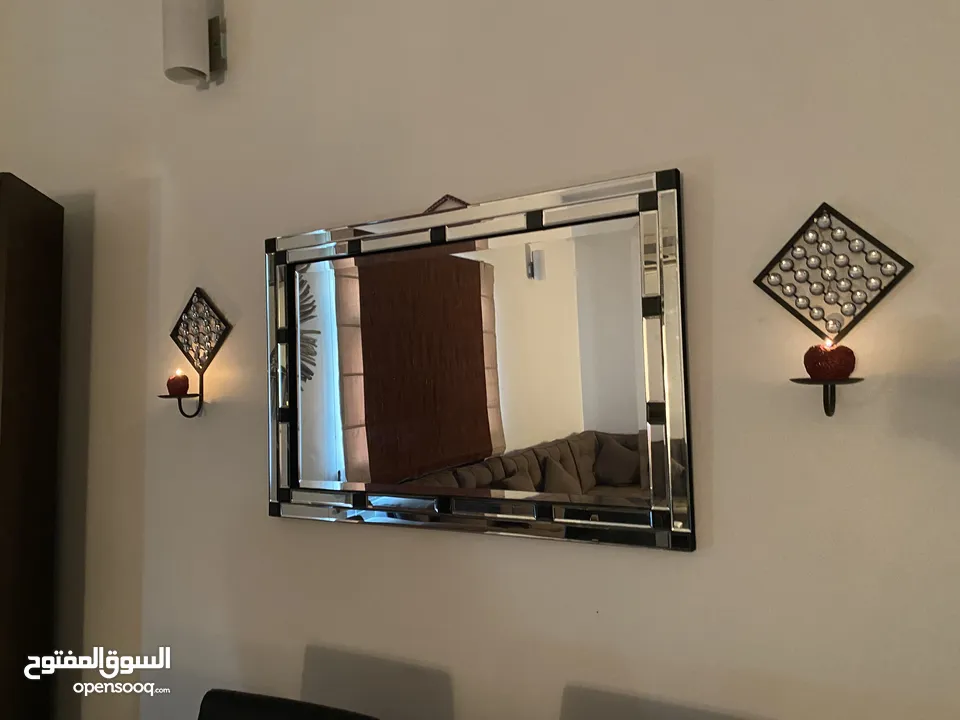 Elegant mirror with two candle holders