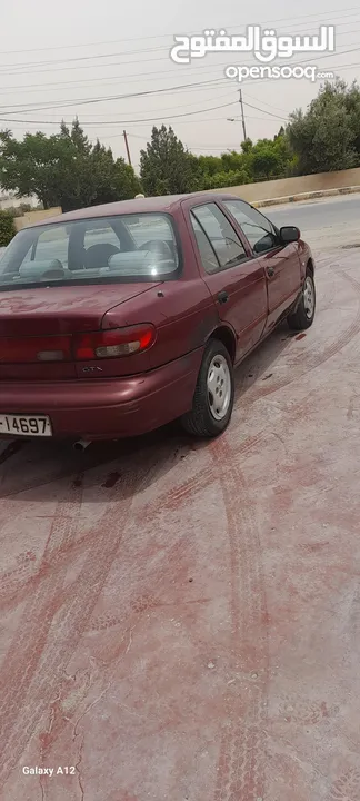 كيا سيفيا 1 لون خمري قير عادي