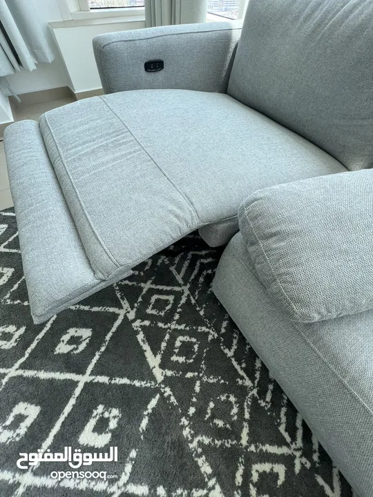 Corner recliner grey sofa with mechanical seat lift, still under warranty