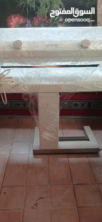 مكوى برادي يعمل عاي الكهرباء