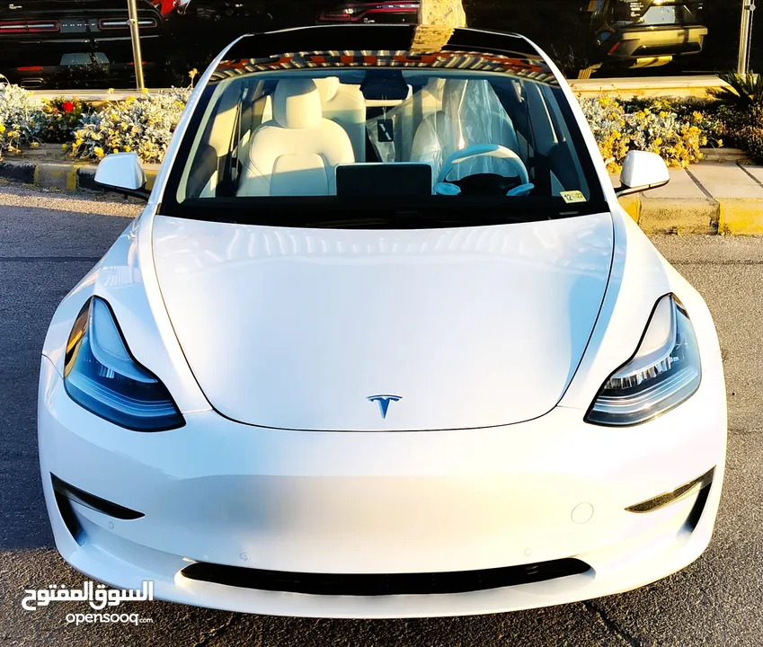 تيسلا 2021 model 3 فحص كامل 4 جـيـد فرش ابيض جنط 19بحالة الوكالة لون مميز للبيع بسعر لقطة ومحروووق