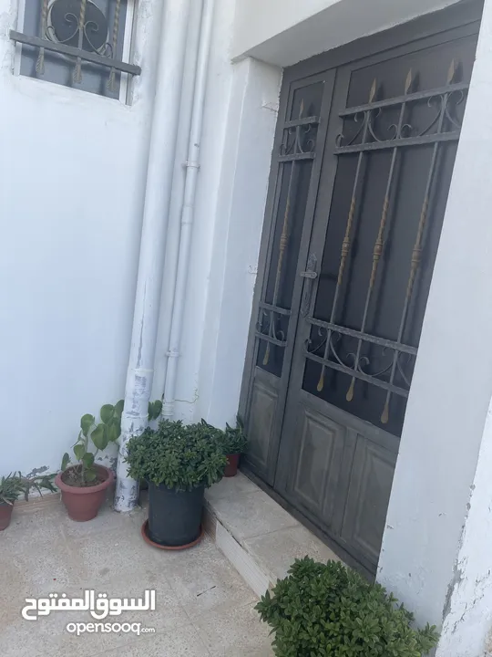 ارض دونم مع بيت ارضي وبيت طابقين