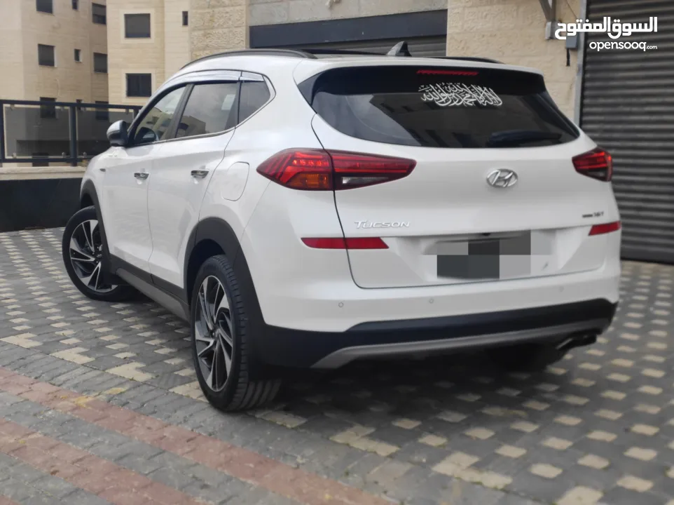 هونداي توسان فل الفل اضافات دهان شركة وعداد أصلي 70000كم فقططط رخصة وتأمين شامل للبيع بسعر مغري