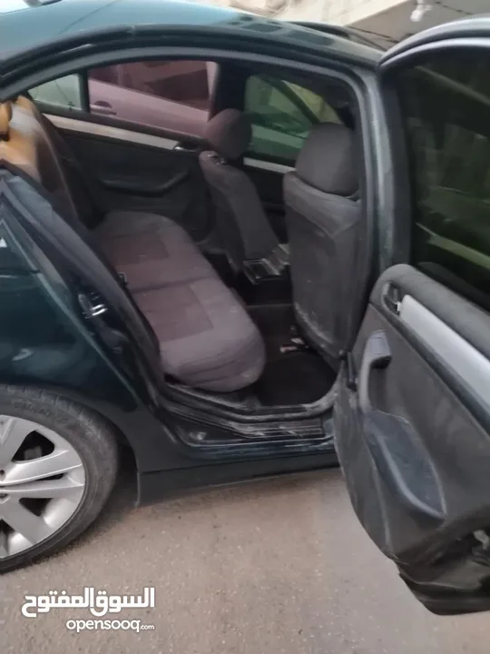 للبيع Bmw e46 2004  لون اخضر زيتي بجننن مع فتحة  دهان جديد السيارة كرتونة