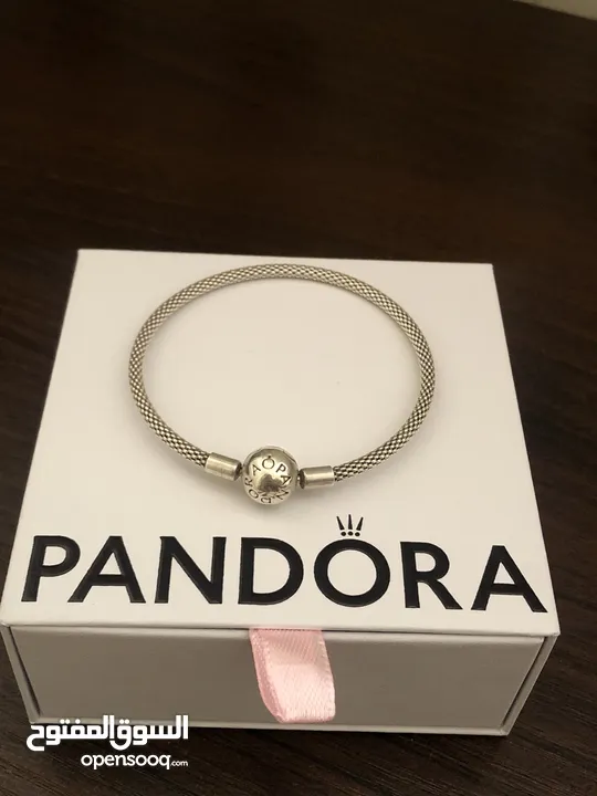 PANDORA bracelet, for sale, plus two charms as a gift. price for all 60 dinars