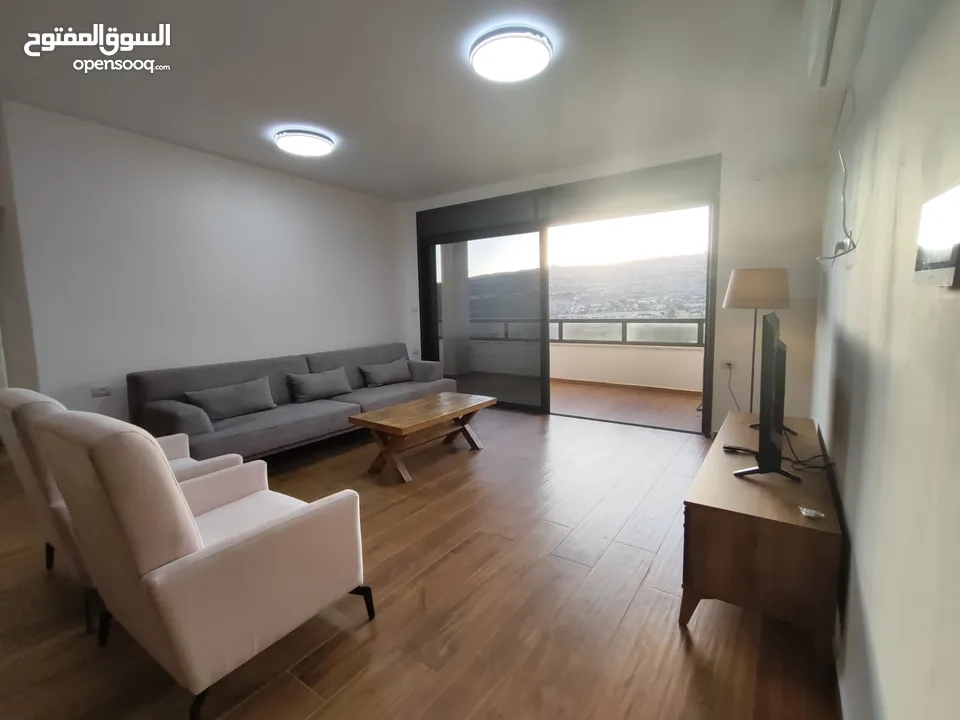 شقة جديدة مفروشة مع حديقة خاصة للإيجار – عين منجد  شارع إسكان المهندسين