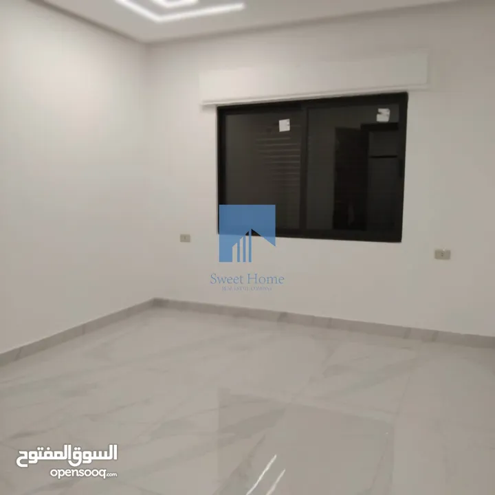شقة أرضية فاخرة للبيع في تلاع العلي  - قرب دوار الواحة 95م مع ترس امامي تشطيب سوبر ديلوكس لم تسكن