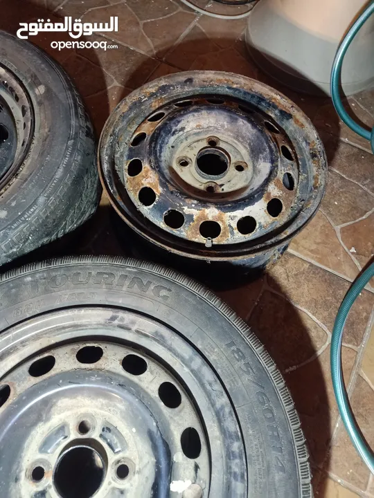 جنط لانسر حديد 14 برغي بعيد عدد 3