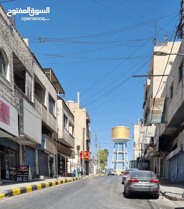 بناية  في موقع حيوي في الزرقاء مؤجرة للبيع بشكل كامل   الرقم المرجعي : 2712