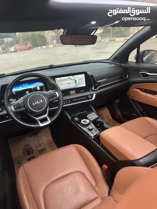 سبورتاج هايبرد 2023 - فل مسكر مع بانوراما - عداد قليل - غرفه مميزه جداً - سعر مميز جداً ع الكاش