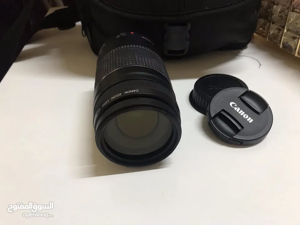 عدسة Canon  75-300 بحالة الوكالة مع الغطاء الأمامي والغطاء الخلفي