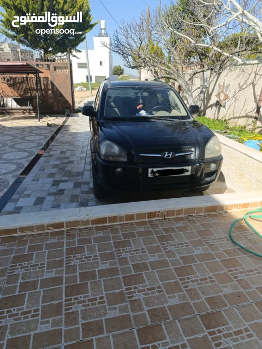 جيب توسان  لون  أسود فتحة سقف 4*4