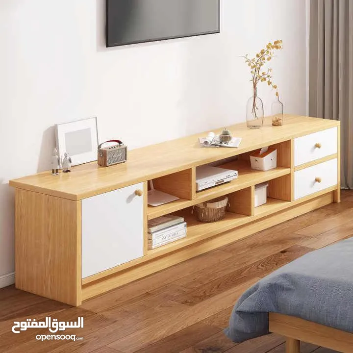 طاولة تلفزيون بلون أبيض وخشبي بتخطف الأنظار! المقاس 160*30*40 سم تصميم مودرن وعصري