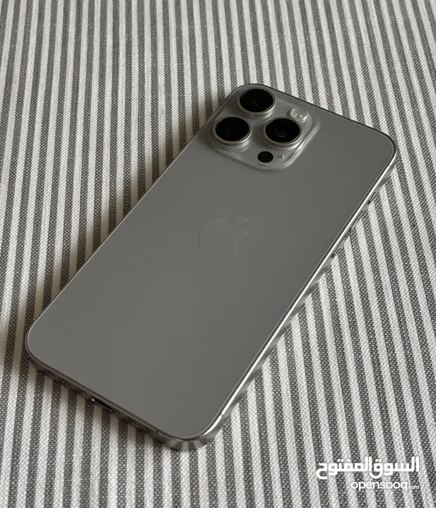 iPhone 15 bro Max natural titanium 256 GB used like a new