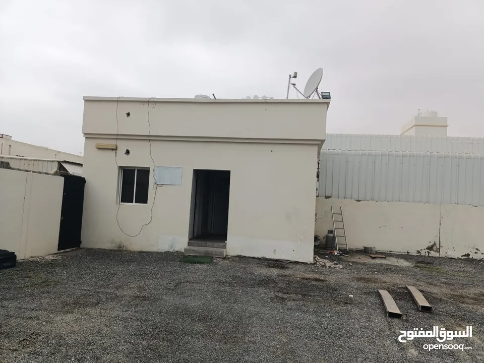 Industrial land for rent in Al misfah with a boundary wall and a guard room أرض صناعية مسورة المسفاة