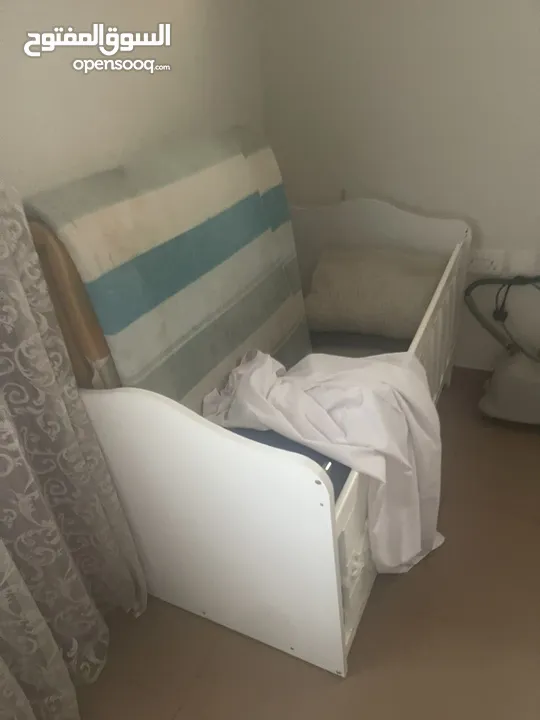 Bed room and cupboard and baby bed