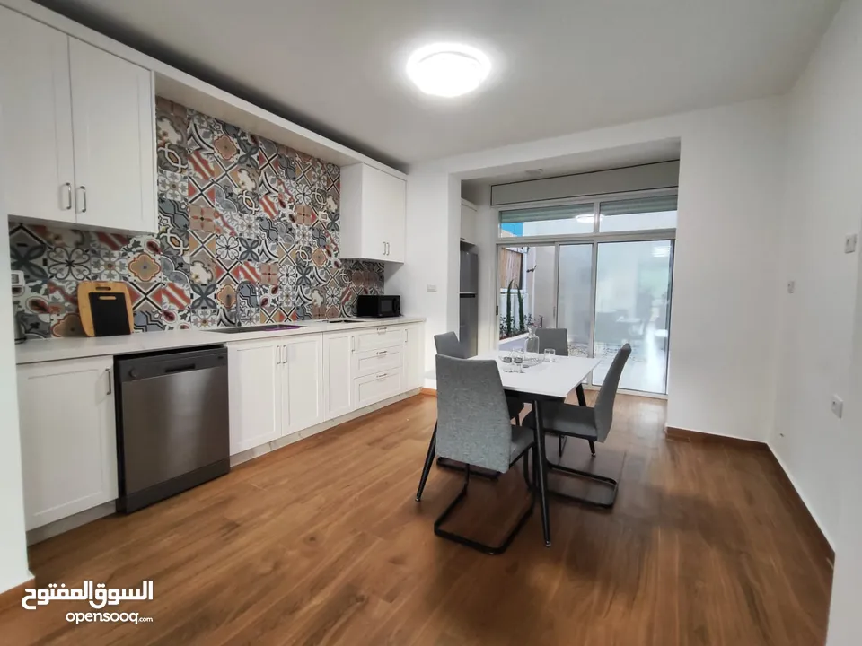 شقة جديدة مفروشة مع حديقة للإيجار – عين منجد  شارع إسكان المهندسين