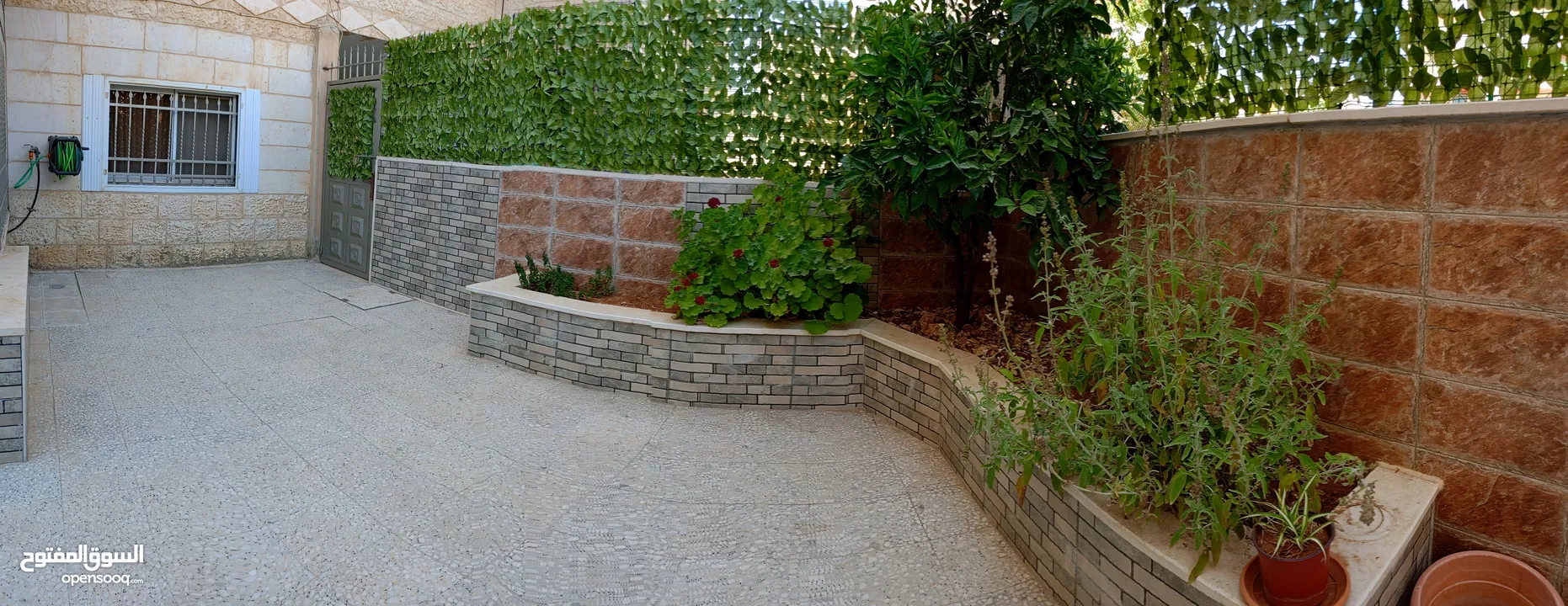 شقة ارضية تشطيب ديلوكس مع حديقة مسورة و مدخل مستقل - ام الشرايط