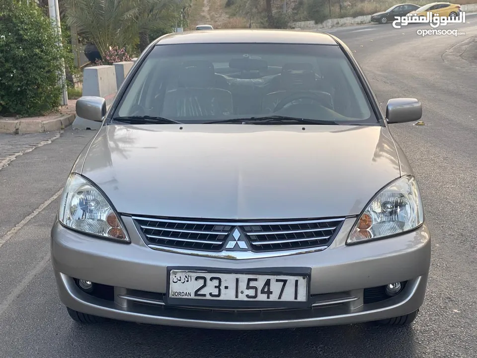ميتسوبيشي لانسر  موديل 2011 GLX ماتور 1600  اصلي وارد الكويت بختم الوكيل الملا الاصلي. فحص كامل