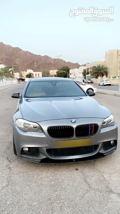 BMW 530i 2013 with body kit.