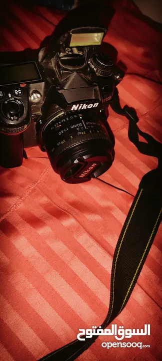 Nikon D7000 with 50mm 1.8F lens مع البطارية والشاحن وعدسه شبه جديده