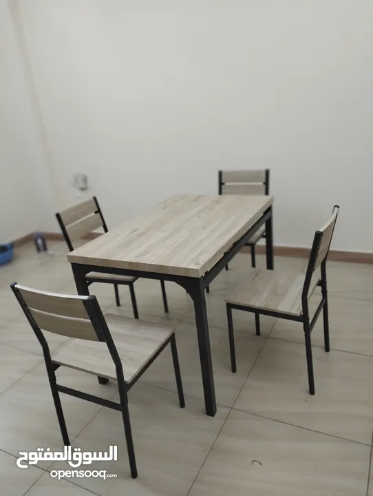 Wooden dining table with 4 chairs.