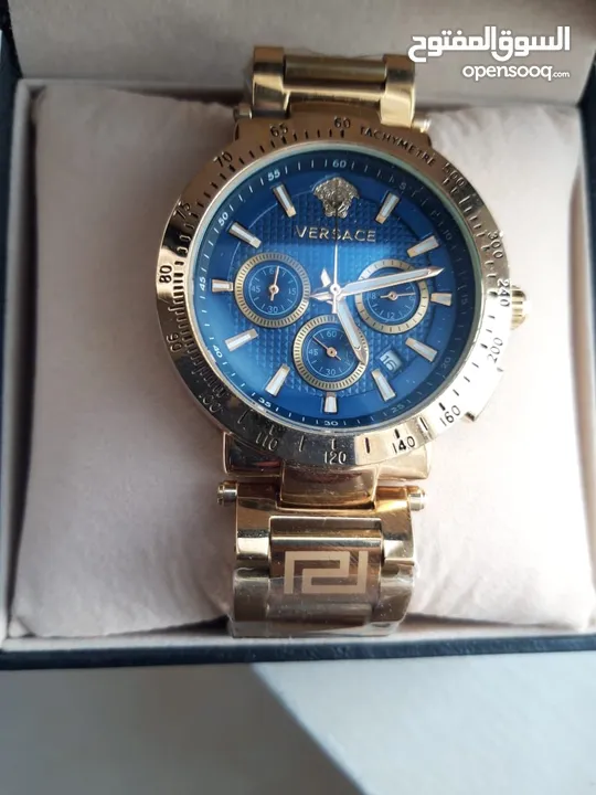 Versace wrist watch with gold chain strap