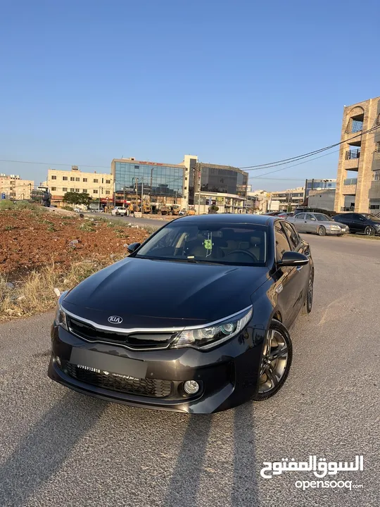 كيا K5 هايبرد موديل ال 2018 لون فيراني ميتالك  فحص اربعة جيد ولا ملاحظة فل كامل عدا الفتحة - كاش