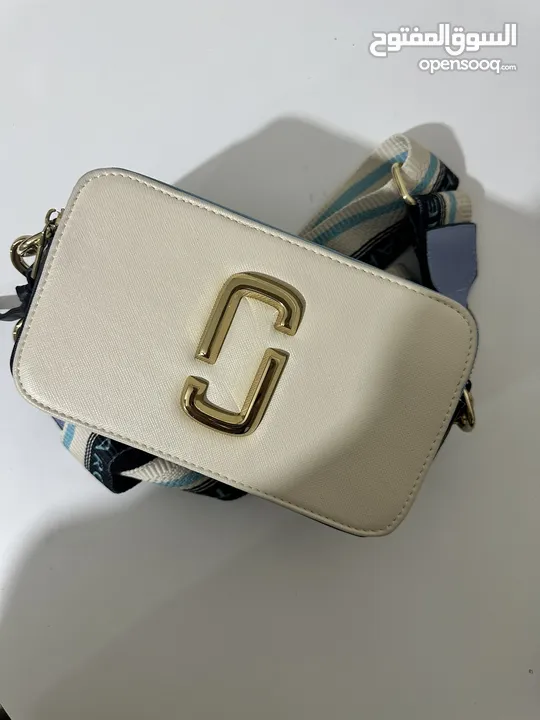 شنتة مارك جاكوب ماستر كوبي مختمة كامل لون بيج مع أزرق فاتح وأسود Marc jacobs bags high master copy