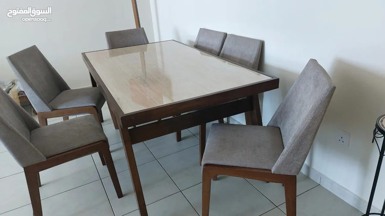 6 seater dining table with chairs light usage available for sale. Price 900 aef