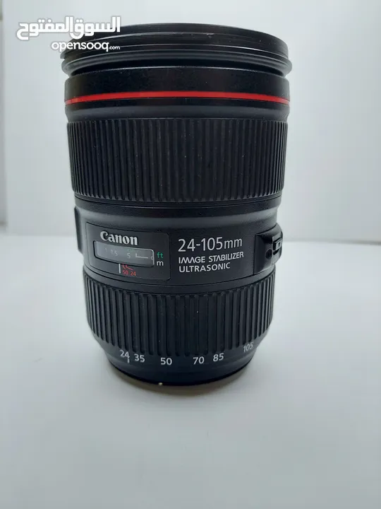 للبيع عدسة 105-24 canon الأصدار الثاني الخط الأحمر، نظيفة جدا+ هود للعدسة مجانا