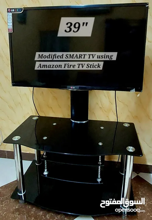 LG 39" SMART TV & Stand using Amazon Fire TV Stick. Original packaging and owners manual available.